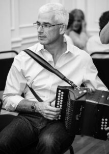 London Irish Traditional Irish Musician Gary Connolly photographed portrait playing the button accordion