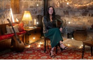 Irish singer Sinead Willox in a room of lights