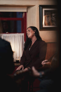 Singer Sinead Willox singing in an Irish pub